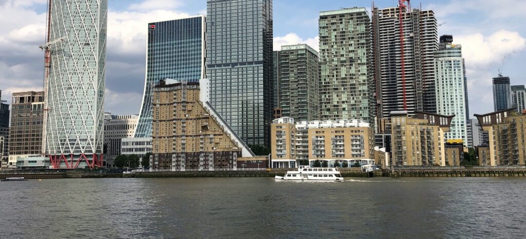 Modern glass skyscrapers and waterfront at Canary Wharf, London Docklands