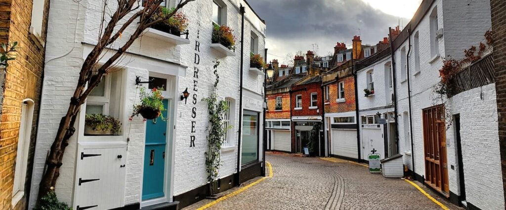 Traditional brick buildings and shopfronts on a historic street in Chiswick, London